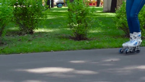 Girl rollerblading in the city park Stock Footage