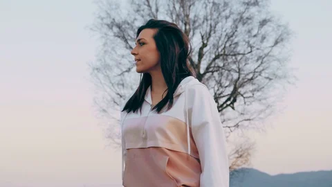 Girl on Rollers Skates Posing by the Tree Stock Footage 129521638