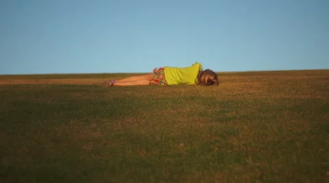 Girl Rolling Down Hill Stock Footage 48949515