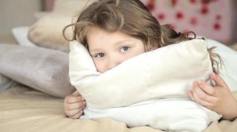 Girl rolls in bed Stock-Footage 62959952