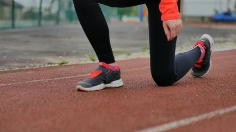 Girl runner preparing to start video Video stock 63889841