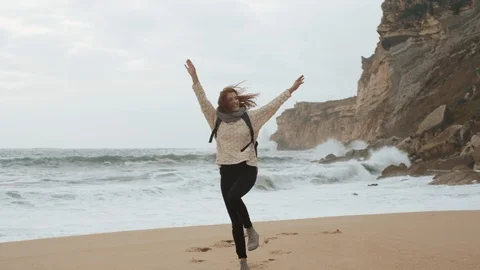 Girl Running Alone On Empty Seashore In Cloudy Cold Weather. Video stock 107739181