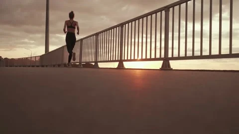 Girl running on the background of the sunset Stock Footage 158222908