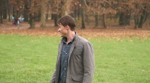 Girl running into father's arms in park Stock Footage 59554136