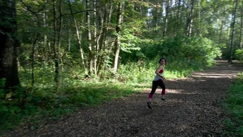 Girl is running in the forest Stock Footage 142493797