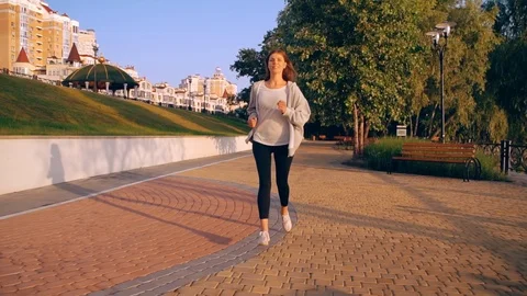 Girl running at sunset Stock Footage 104825220