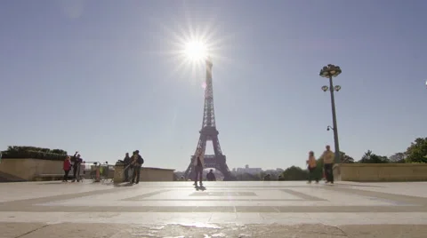 Girl running though Paris with Eiffel tower in the background. Video stock 63022441