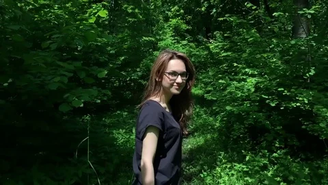 Girl is running through the forest Stock Footage 78791674