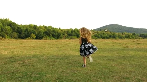 Girl runs away in front of camera Stock Footage 67248317