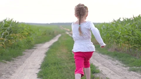 Girl runs down the path Stock Footage 168497824