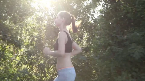 The girl runs into the forest sports life coaching Stock Footage