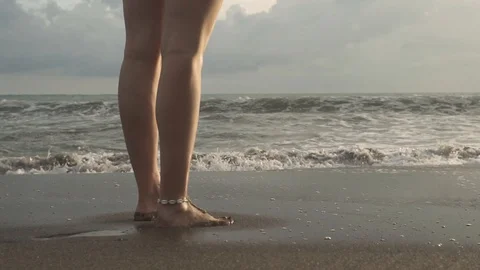 Girl runs on the sand Stock Footage