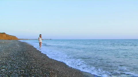 The girl runs to the sea Stock Footage
