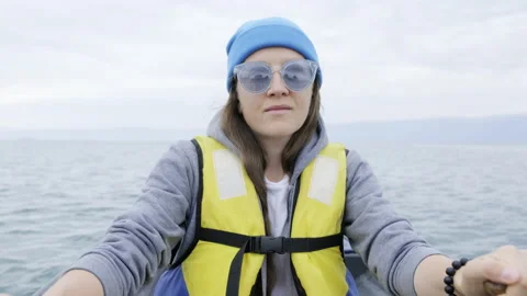 A girl sails in a boat on oars Stock Footage 169082853