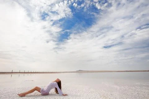 Girl on the salt beach Foto stock