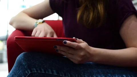 Girl sat using her Apple iPad 動画素材 79209756