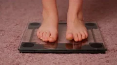 Woman On Scales Measure Weight. Girl Leg, Stock Video