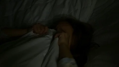 The girl is scared in bed Stock Footage 85436467