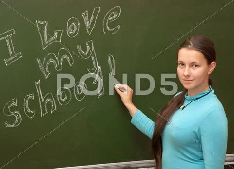 Girl schoolgirl meets an english lesson Stock Photos