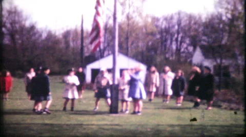 Girl scouts raise the flag and salute 1950s vintage film home movie 8 Stock Footage