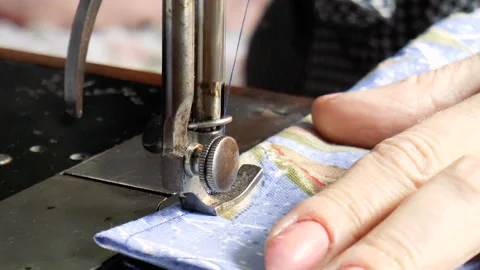 Girl scribbles on the sewing machine Stock Footage 90775659