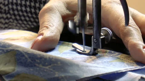 Girl scribbles on the sewing machine Stock Footage 90775716