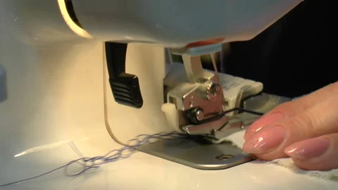 Girl scribbles on the sewing machine Stock Footage 90775744