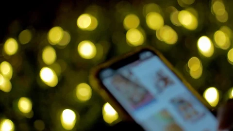 Girl Scrolling, Smartphone, Camera Pulls Back, 4K Stock Footage 120916451