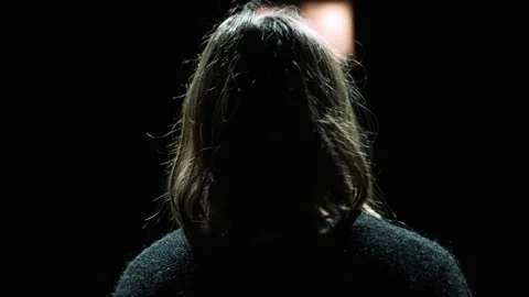 Girl seen from behind while singing in a theatre. Stock Footage 228949616