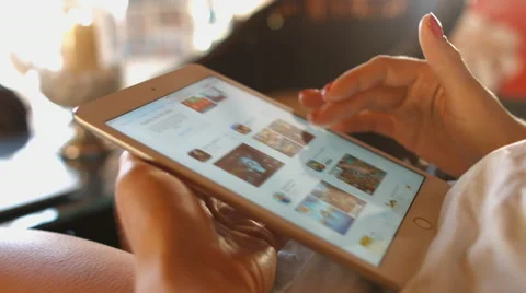 Girl selects an application on a Tablet PC . 4K 30fps ProRes (HQ) Stock Footage 67008149