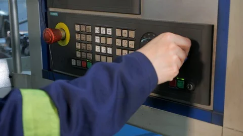 The girl selects the operating modes of the lathe. Close-up. Stock Footage 116764194