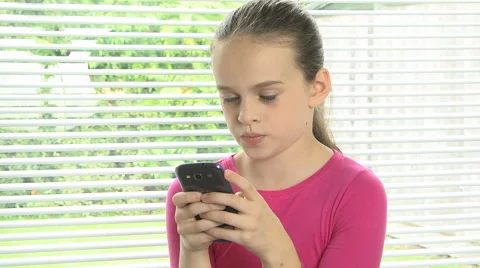 Girl sending text message on mobile phone Stock Footage 46727488