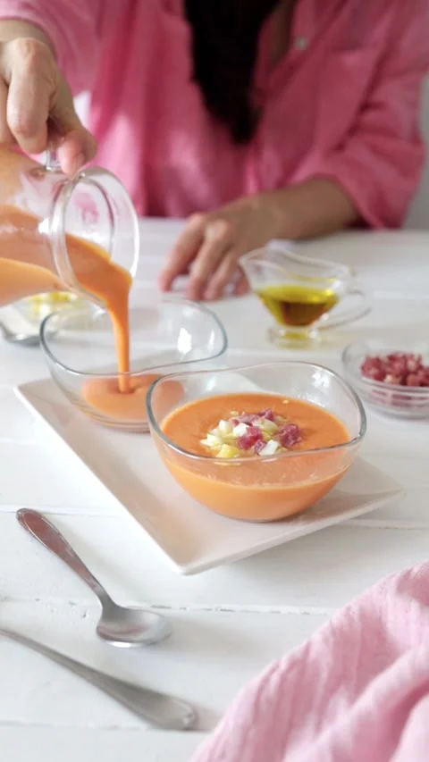 Girl Serving Salmorejo with Boiled Egg and Ham Stock Footage 281004331