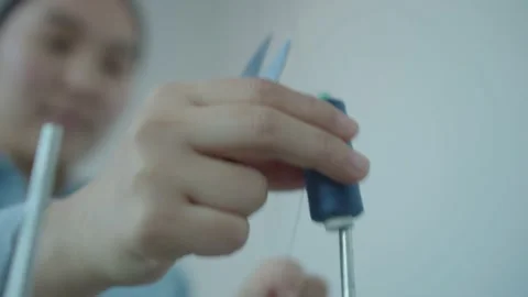 Girl serving a sewing machine Stock Footage 234874294