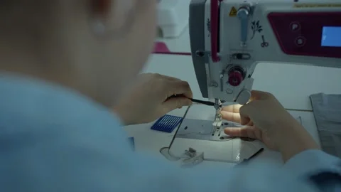 Girl serving a sewing machine Stock Footage 234874331