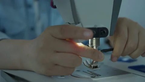 Girl serving a sewing machine Stock Footage 234874377