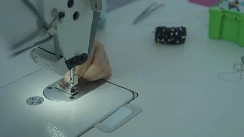 Girl serving a sewing machine Stock Footage 234874397
