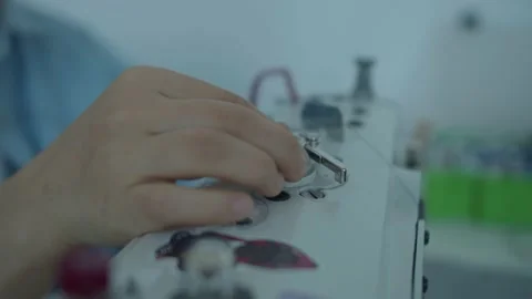 Girl serving a sewing machine Stock Footage 234874463