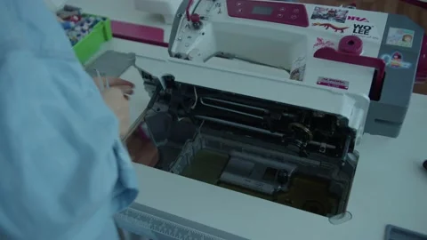 Girl serving a sewing machine Stock Footage 234874530
