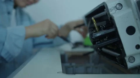 Girl serving a sewing machine Stock Footage 234874607