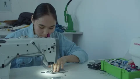 Girl serving a sewing machine Stock Footage 234874706