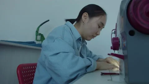 Girl serving a sewing machine Stock Footage 234874708