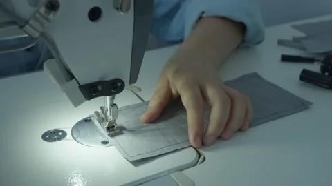 Girl serving a sewing machine Stock Footage 234874830