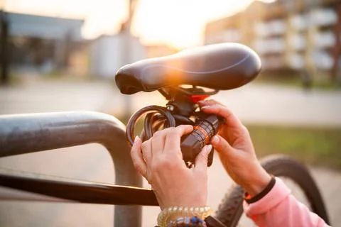 Girl Sets Code On A Code Bike Lock Stock Photos