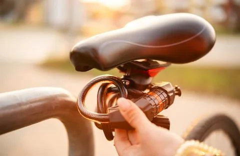 Girl Sets Code On A Code Bike Lock 写真素材