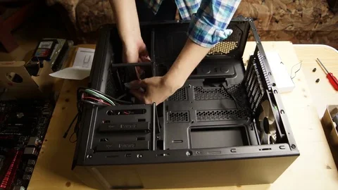 Girl sets of the components in the system unit. Stock Footage 70276287