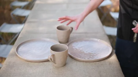 Girl setting the table for lunch Stock Footage 305306464