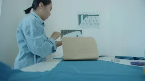 Girl in the sewing studio Stock Footage 234872813