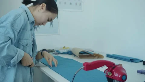 Girl in the sewing studio Stock Footage 234872901