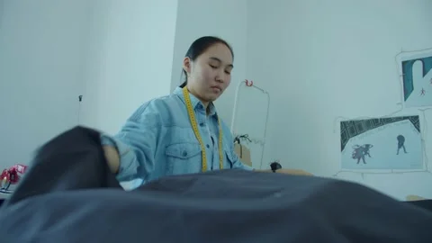 Girl in the sewing studio Stock Footage 234873532